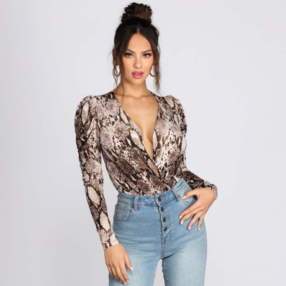 NWT sexy snakeskin bodysuit. Size M. Never been worn. Silky material